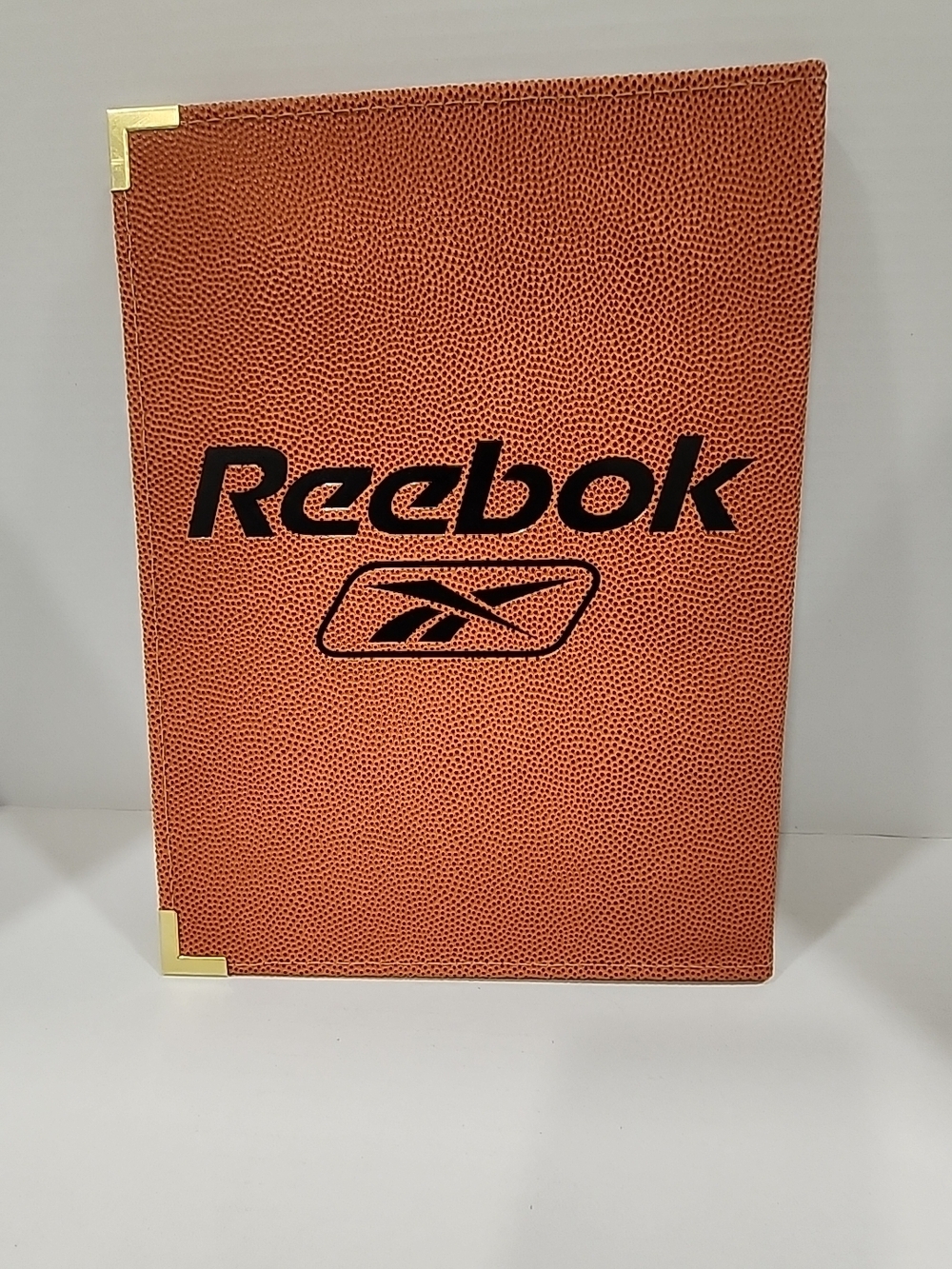 Reebok Orange Pebbled Basketball-Style Notebook with Gold Corners
